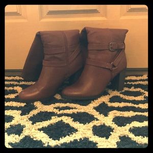 Brown stacked heeled boots.
